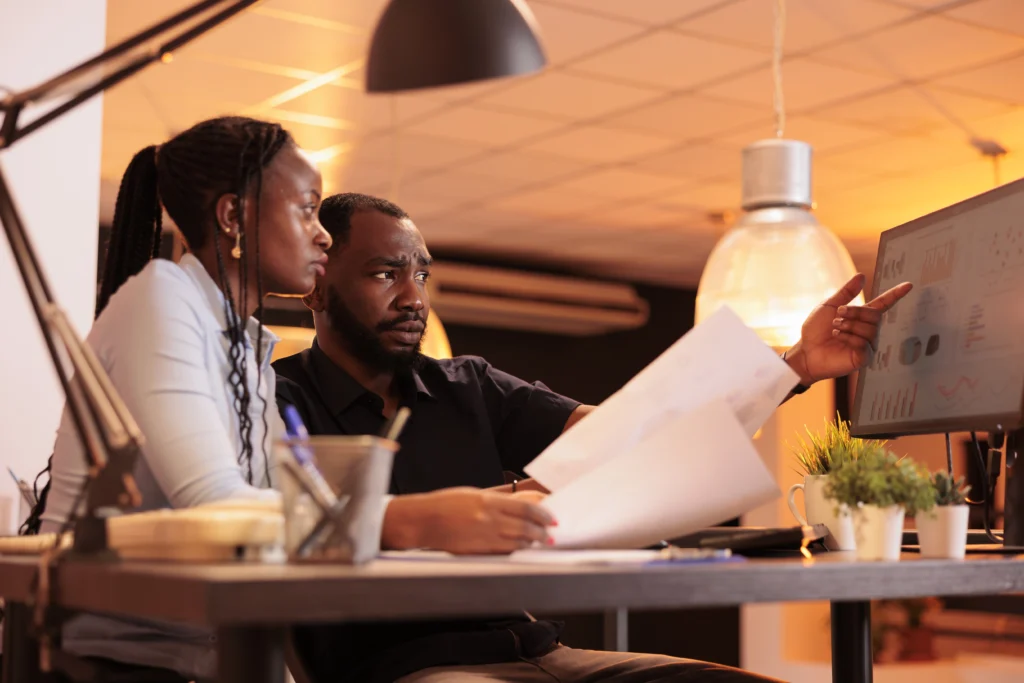 african american man woman doing teamwork collaboration presentation report looking data computer pa